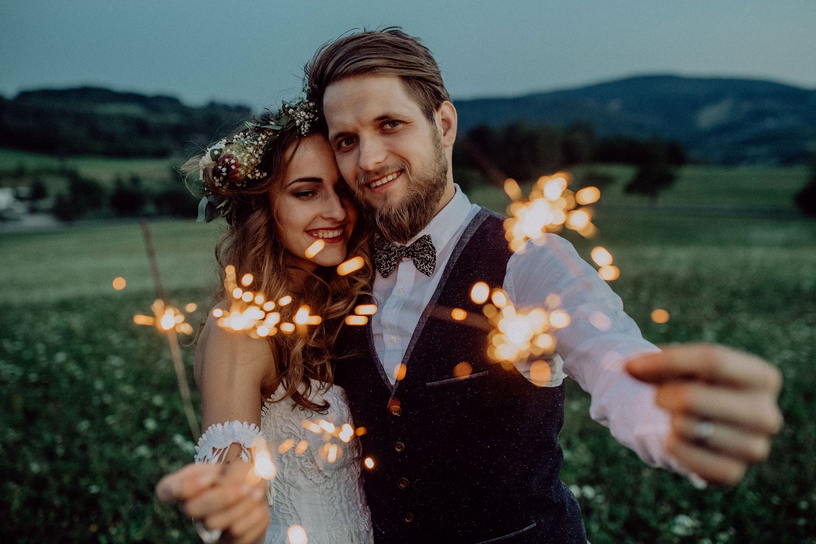 beautiful-bride-and-groom-on-a-meadow-in-the-eveni-P8TUGS9-gallery.jpg